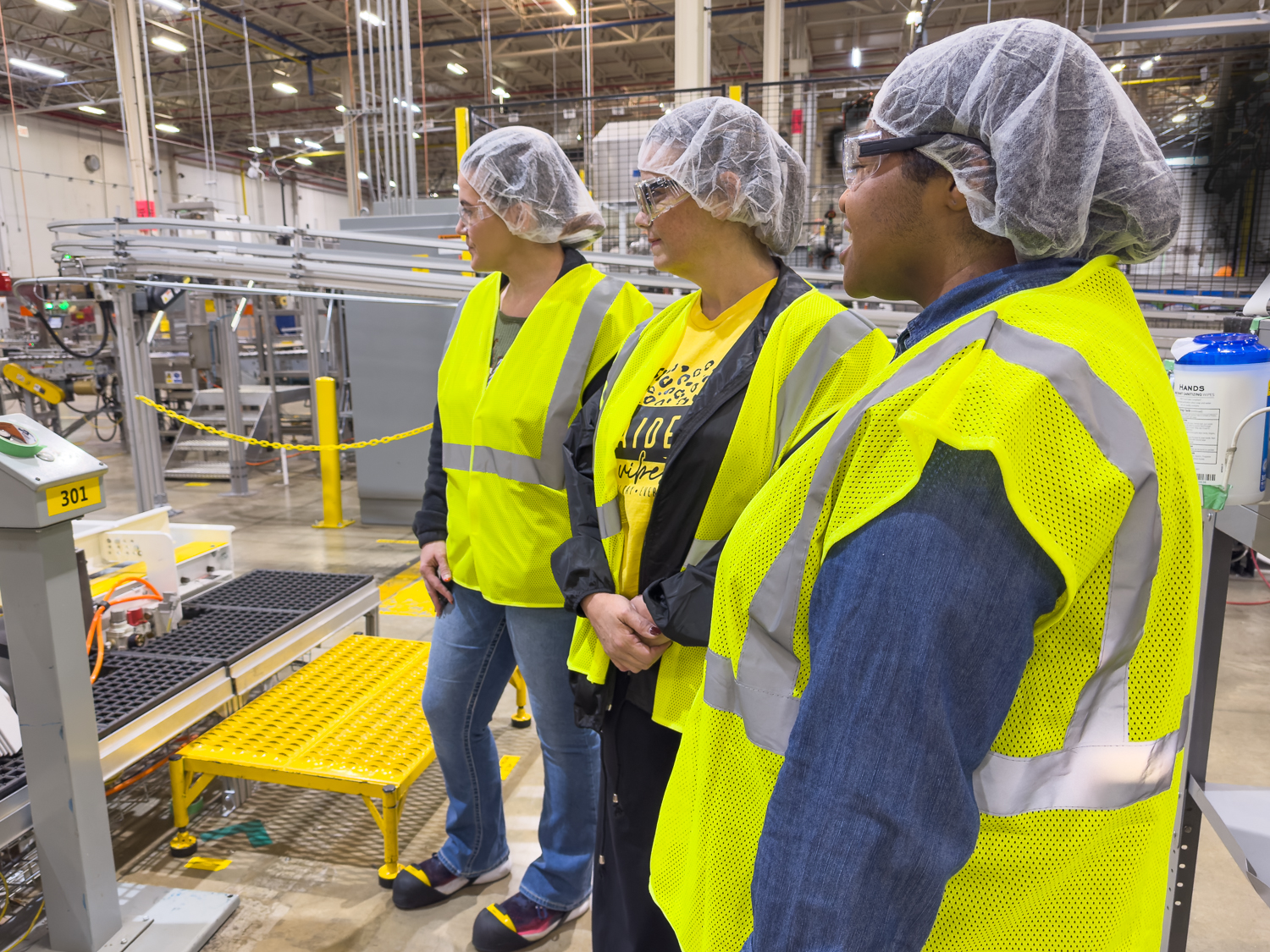 Educators inside Nice-Pak taking a look at a manufacturing process