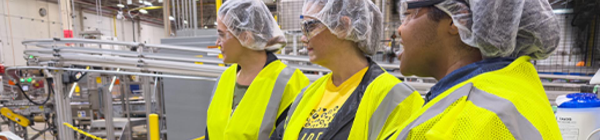 Educators at Nice-Pak watching the manufacturing process on the factory floor