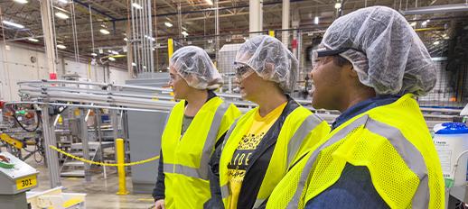 Educators at Nice-Pak watching the manufacturing process on the factory floor