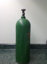 tall air bottle, color green, used.